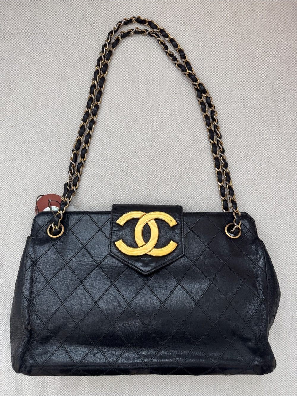 CHANEL Black Quilted Leather Shoulder Bag with Gold CC Emblem
